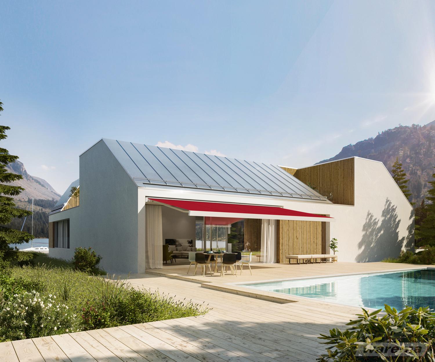 Haus mit Pool und Markise über der Terrasse